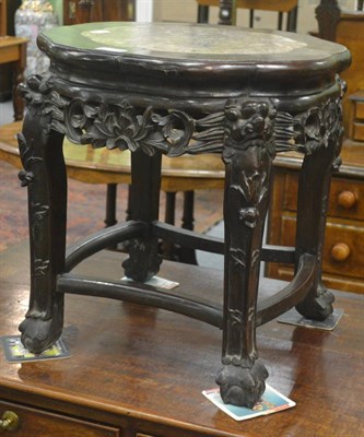 Lot 6301 - A Chinese hardwood plant stand with marble top