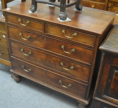 Lot 6302 - A George III mahogany chest of drawers with two short and three long drawers on turned baluster...