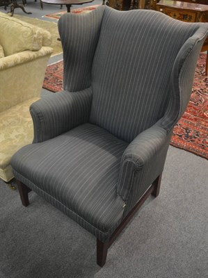 Lot 6314 - A 19th century large gentleman's wing armchair on mahogany frame