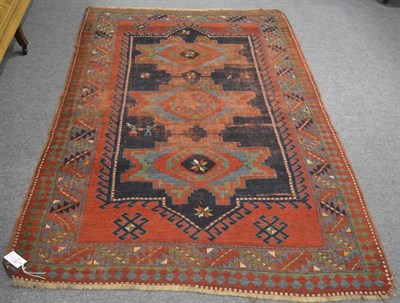 Lot 6326 - A Kazak Rug, Central Caucasus, the indigo field with three Lesghi guls enclosed by serrated...