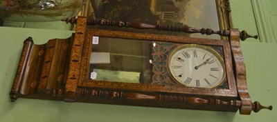 Lot 6382 - An inlaid striking wall clock