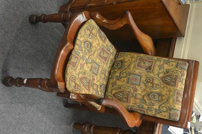 Lot 6393 - A 19th century mahogany open armchair with dished seat, out-scrolled arms and a crinoline stretcher