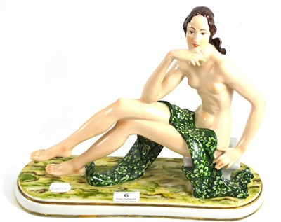 Lot 6 - Karl Ens porcelain figure of nude young woman, designed by H Rutz, in a seated pose, blue...