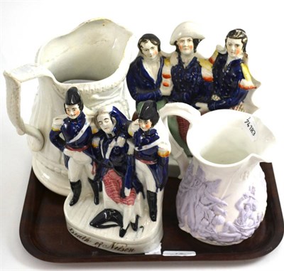 Lot 19 - Two Staffordshire figure groups of Lord Nelson together with two jugs, one depicting Admiral...