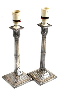 Lot 31 - Pair of silver candlesticks (adapted for electricity)