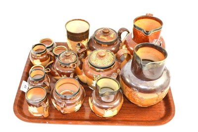 Lot 44 - A tray of Doulton Lambeth including teapots, jugs, a beaker, etc (many with silver rims)