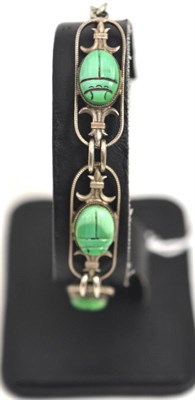Lot 59 - Scarab bracelet, intaglio hieroglyphic designs to the reverse of each scarab, in lozenge shaped...