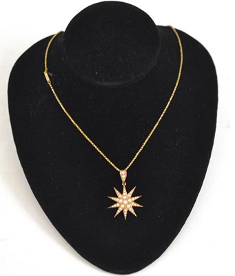 Lot 65 - Seed pearl set star pendant on chain