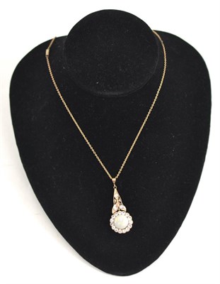 Lot 85 - An opal and white paste pendant on chain