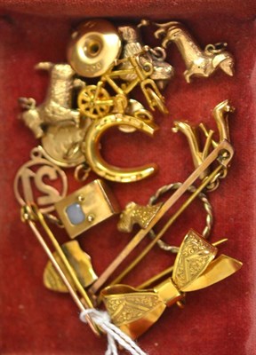 Lot 95 - Assorted charms including eight 9ct gold examples (bicycle, pair of shoes, two dogs, TV, key,...