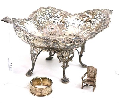 Lot 111 - Pierced silver dish, by James Dixon & Sons, silver napkin ring and a white metal miniature chair