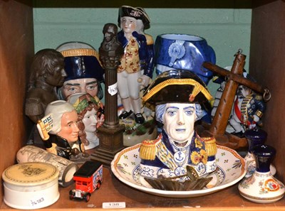 Lot 138 - A large group of Nelson memorabilia including Delft character jug, faience ware, Royal Doulton...