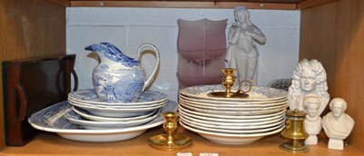 Lot 147 - An oil lamp, blue and white plates, three cranberry shades, Parian figures, etc (one shelf)