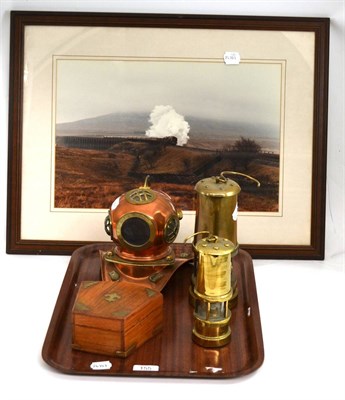 Lot 155 - Two brass miners lamps, a reproduction surveyor's level, a copper model of a divers helmet and...