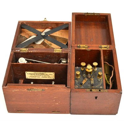 Lot 169 - An oak cased ";Pulvelec"; dry cell cabinet battery together with another vintage cased battery