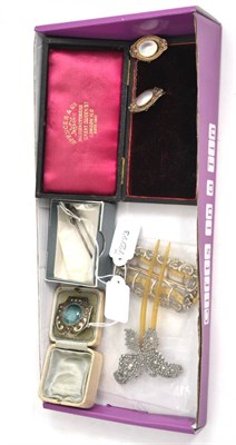 Lot 198 - A mother-of-pearl set double brooch, a Ruskin style brooch, a brooch pin in the style of...