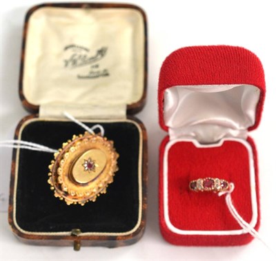 Lot 202 - A ruby and diamond set Victorian brooch, stamped '15CT' and a 9ct gold ring, similarly set (2)