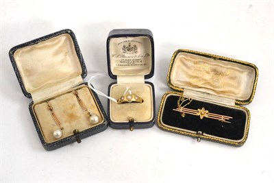 Lot 207 - A three stone split pearl ring stamped '18C', a seed pearl set floral motif bar brooch and a...