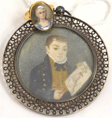 Lot 209 - 9ct gold ring set with a portrait miniature of a young lady in a blue dress and a circular portrait