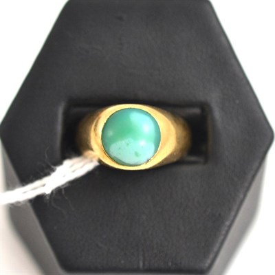 Lot 226 - A signet ring set with a green stone