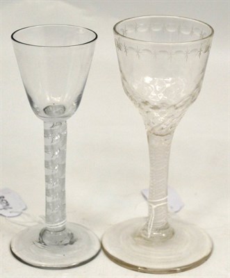 Lot 243 - Two late 18th century glasses, one with double series opaque twist stem and engraved bowl, the...