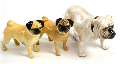 Lot 253 - Two Beswick pugs and a Royal Doulton bulldog