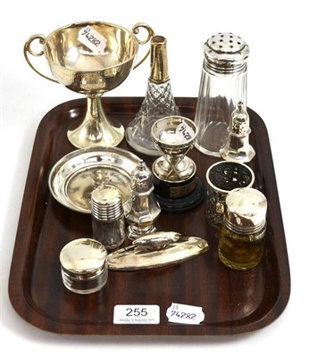 Lot 255 - Small silver including a trophy cup, lidded jars, peppers, dish etc