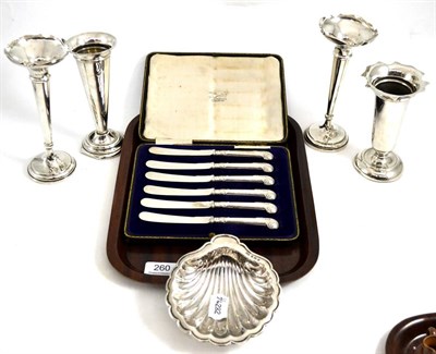 Lot 260 - A silver shell butter dish, four silver vases and cased silver handled knives