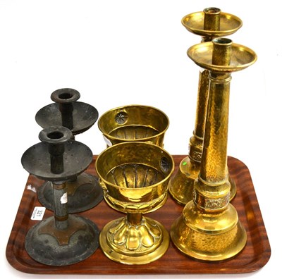 Lot 321 - A pair of Arts & Crafts brass candlesticks, unmarked, 38cm; a pair of Arts & Crafts brass chalices