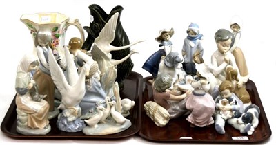 Lot 334 - A group of fifteen Lladro and Nao porcelain figures, a Dartmouth pottery glug jug and a Maling...