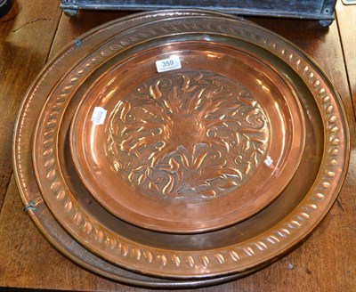 Lot 359 - Three Art & Crafts copper chargers, 46cm, 43cm and 33cm