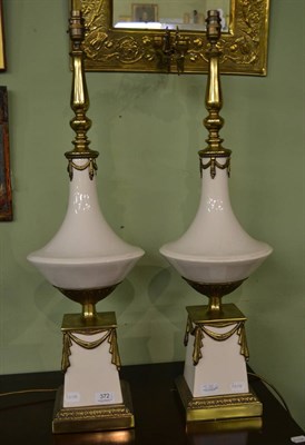 Lot 372 - Pair of ceramic urns with brass garland lamps (damaged)