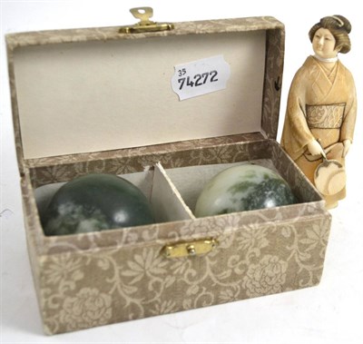 Lot 406 - Meiji period carved ivory figure of a geisha and two jadeite balls in a fitted box