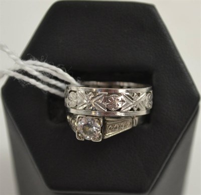 Lot 411 - Single stone ring inscribed platinum and a band ring inscribed 'Plat' (2)