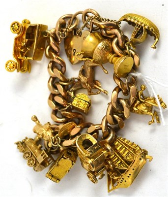 Lot 415 - 9ct gold charm bracelet with 9ct gold charms and a plated Mickey Mouse charm