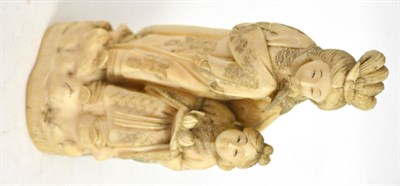 Lot 440 - Japanese Meiji period one piece carved ivory okimono of two young children, one holding two...