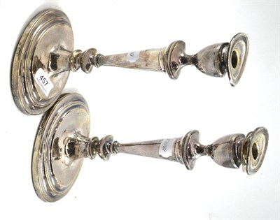 Lot 457 - Pair of Britannia standard silver Neo Classical style candlesticks, Hendeles & Co, London 1913...