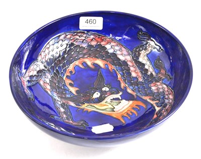 Lot 460 - A modern William John Moorcroft Dragon pattern bowl, designed by Trevor Critchlow, on a blue...