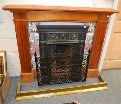 Lot 1000 - Cast iron fire place with tiled surround, a fender and a spark guard