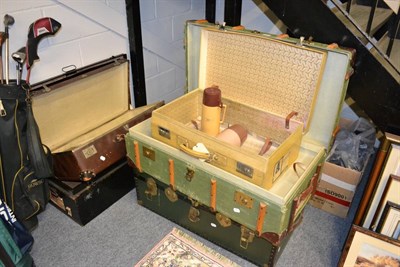 Lot 1004 - Tin trunk, green travelling trunk, two suitcases and green canvas cabin trunk (5)