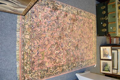 Lot 1006 - Artificial silk machine made rug of oriental design, the coral pink field with tree of life and...