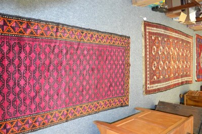 Lot 1018 - Balouch rug, Persian/Afghan Frontier, the stepped diamond lattice field of guls enclosed by mustard