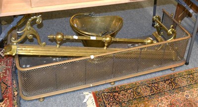 Lot 1072 - Two brass fenders together with a brass coal bucket