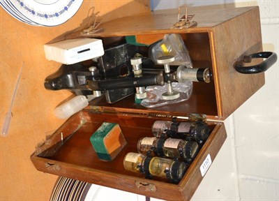 Lot 1110 - W Watson & Sons student's microscope with accessories, in wooden case