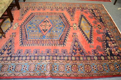 Lot 1130 - Viss carpet, North West Persia, the brick red field with large hooked medallions framed by...