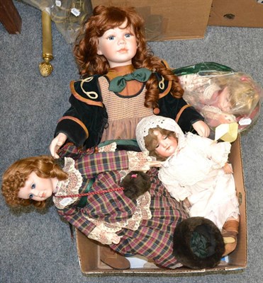 Lot 1159 - Armand Marseille doll with three other costume dolls