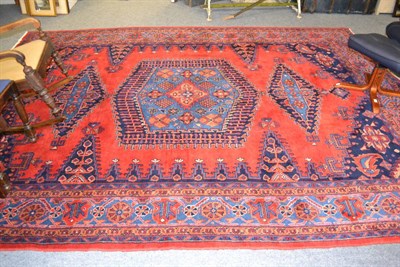 Lot 1215 - Viss carpet, North West Persia, the crimson field centred by a sky blue medallion framed by...