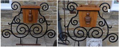 Lot 1216 - Pair of wrought iron planters with oak liners