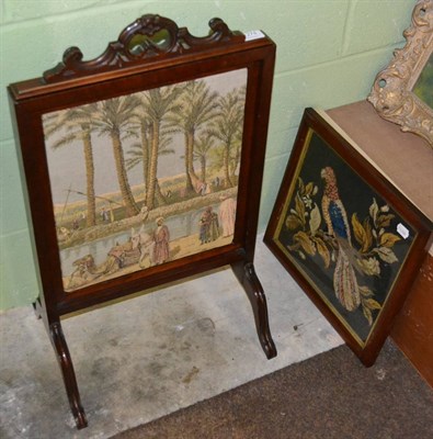 Lot 1278 - Victorian woolwork picture of a parrot and a mahogany firescreen with machine worked insert on...