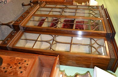 Lot 1299 - Large mahogany breakfront cabinet with glazed doors and blind fret carving